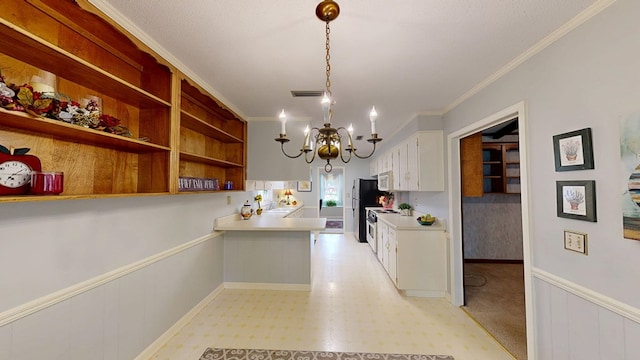 2104 Centenial Dr, Dothan, AL 36303 - kitchen with a chandelier, crown molding, white cabinets, a peninsula, and light countertops