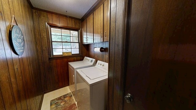 2104 Centenial Dr, Dothan, AL 36303 - washroom featuring washer and dryer, a textured ceiling, wooden walls, and ornamental molding