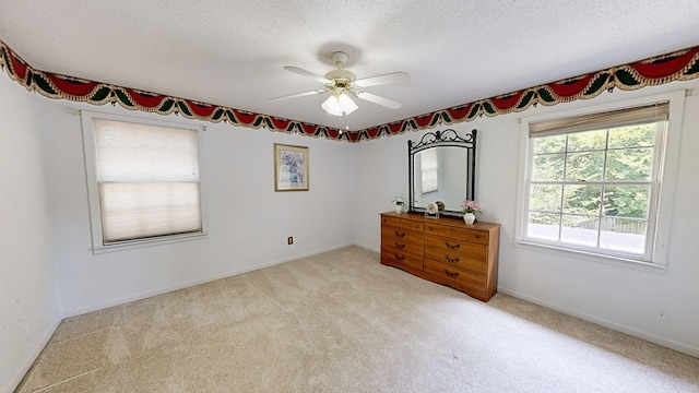 2104 Centenial Dr, Dothan, AL 36303 - bedroom with a textured ceiling, light colored carpet, and ceiling fan