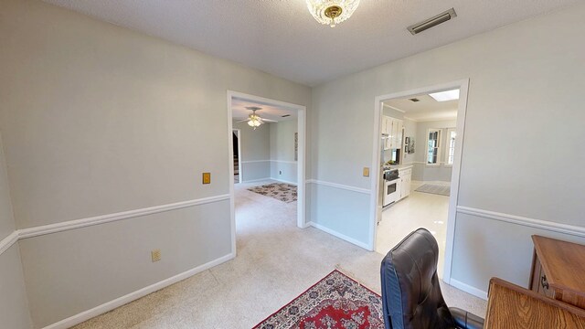 2104 Centenial Dr, Dothan, AL 36303 - hall featuring carpet flooring, a textured ceiling, and a desk