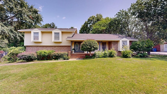 2104 Centenial Dr, Dothan, AL 36303 - split level home featuring brick siding and a front lawn