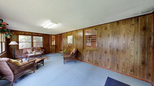 2104 Centenial Dr, Dothan, AL 36303 - carpeted living room with wood walls and a textured ceiling