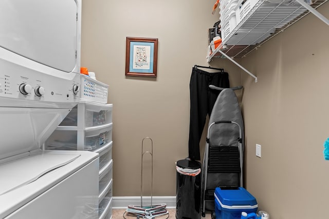 washroom with stacked washer / dryer