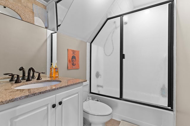 full bathroom featuring shower / bath combination with glass door, vanity, and toilet