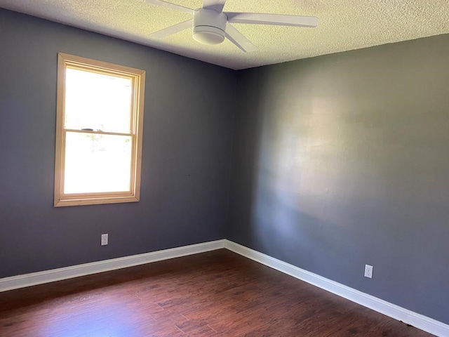 spare room with ceiling fan, a textured ceiling, and hardwood / wood-style flooring