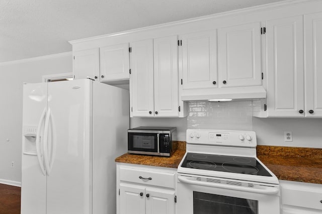1104 Strathmore Ave, Dothan, AL 36303 - kitchen with white appliances, under cabinet range hood, dark countertops, white cabinets, and ornamental molding
