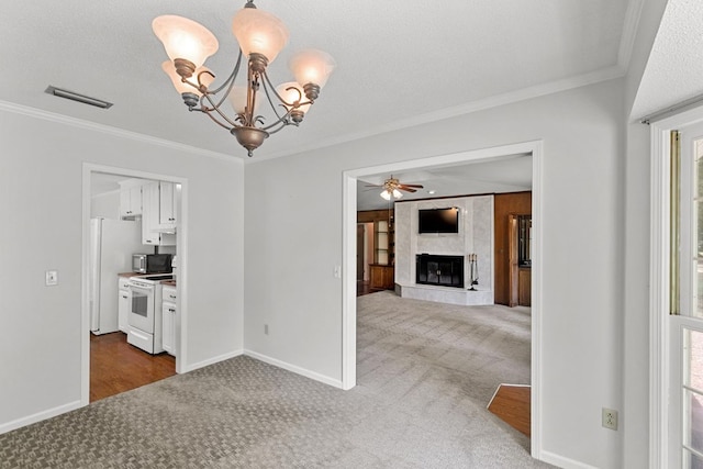 1104 Strathmore Ave, Dothan, AL 36303 - spare room featuring carpet floors, crown molding, a high end fireplace, a chandelier, and ceiling fan