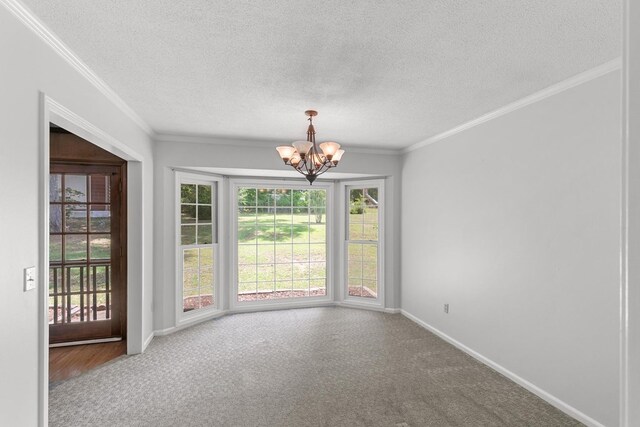 1104 Strathmore Ave, Dothan, AL 36303 - empty room with a chandelier, a textured ceiling, ornamental molding, and carpet floors