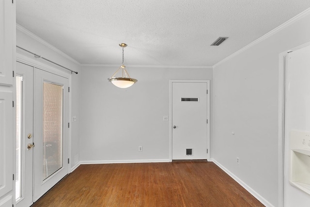 1104 Strathmore Ave, Dothan, AL 36303 - spare room featuring wood finished floors, a textured ceiling, and crown molding