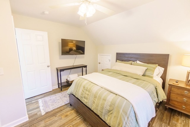 bedroom featuring wood-type flooring, ceiling fan, and lofted ceiling