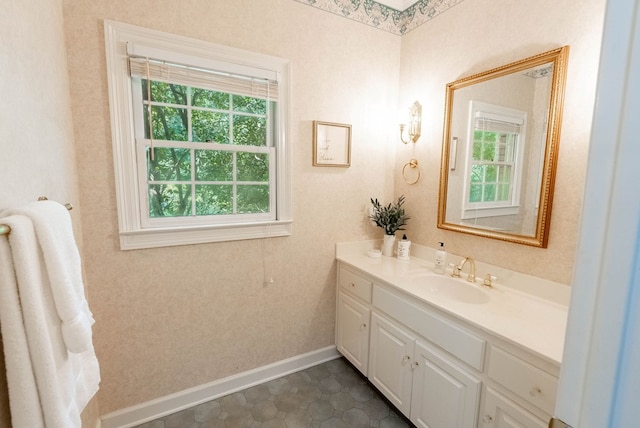 bathroom featuring tile patterned flooring and vanity