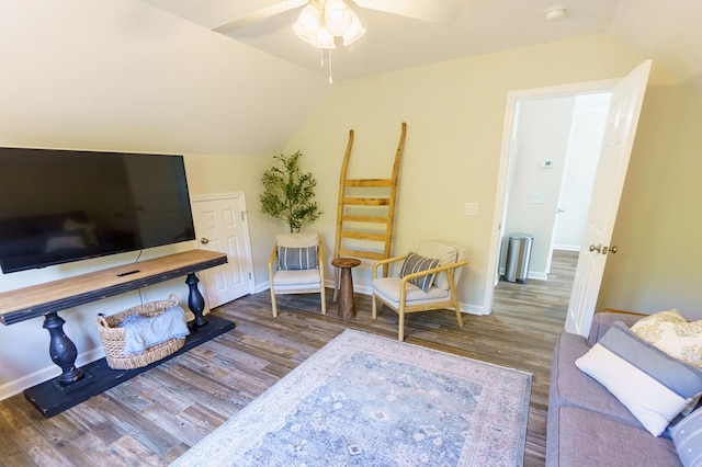 living room with hardwood / wood-style floors, ceiling fan, and lofted ceiling