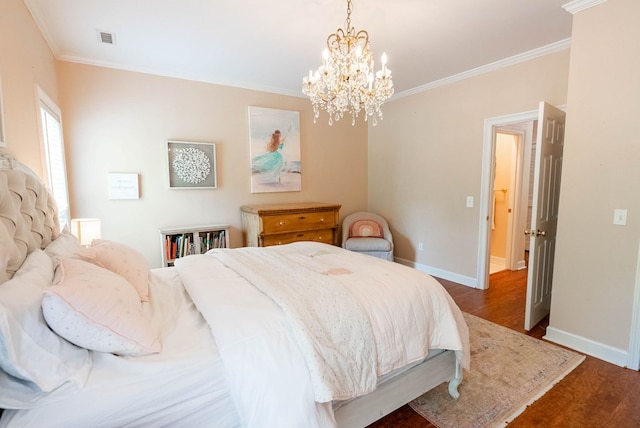 bedroom featuring dark hardwood / wood-style flooring, ornamental molding, and a chandelier