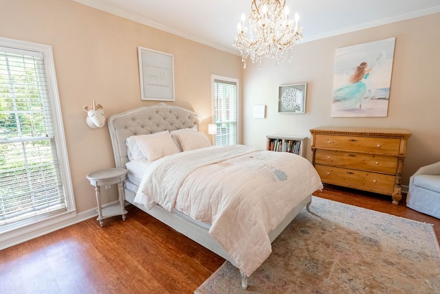 bedroom with multiple windows, crown molding, dark hardwood / wood-style floors, and a notable chandelier