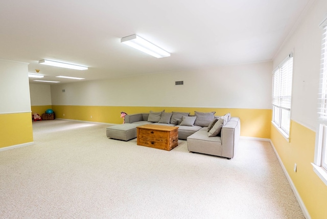 living room featuring carpet flooring and ornamental molding