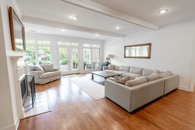 living room with beamed ceiling, wood-type flooring, french doors, and crown molding