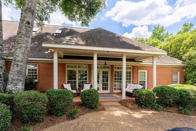 rear view of house with a porch