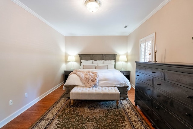 bedroom with hardwood / wood-style floors and ornamental molding