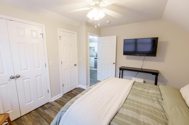 bedroom featuring ceiling fan, dark wood-type flooring, and vaulted ceiling