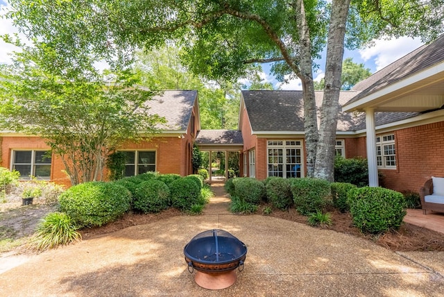 view of front of home with an outdoor fire pit