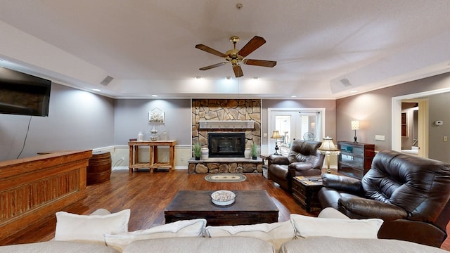 103 Yorkshire St, Dothan, AL 36305 - living area featuring a ceiling fan, wood finished floors, a fireplace, a raised ceiling, and ornamental molding