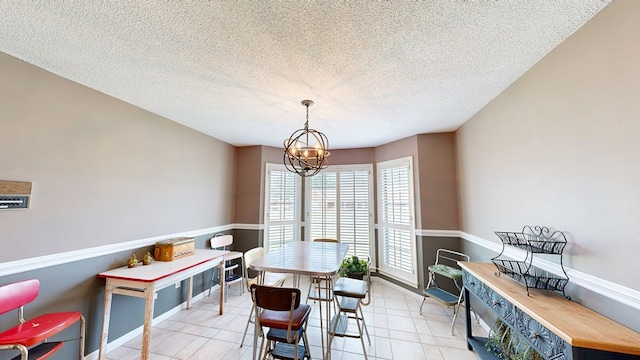 103 Yorkshire St, Dothan, AL 36305 - dining space with a textured ceiling, a chandelier, and light tile patterned floors