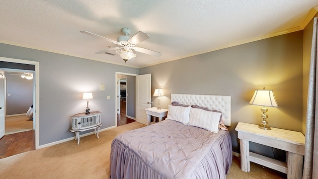 103 Yorkshire St, Dothan, AL 36305 - bedroom featuring crown molding, light colored carpet, a ceiling fan, and a textured ceiling