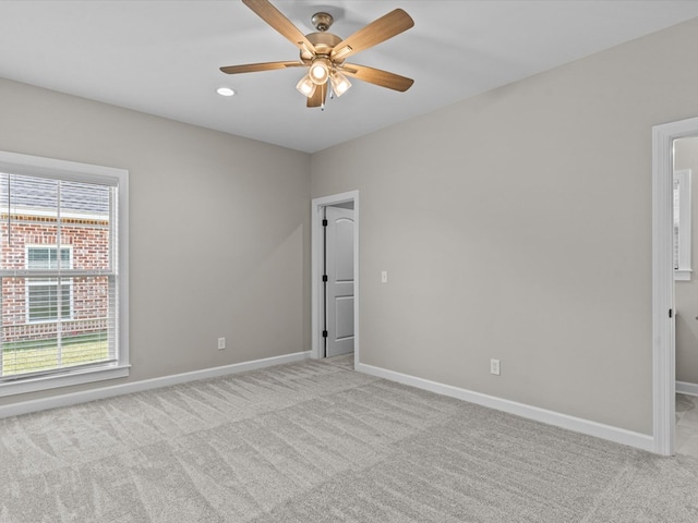 unfurnished room featuring light carpet, baseboards, ceiling fan, and recessed lighting