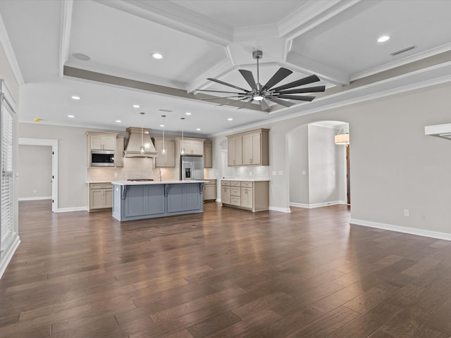 unfurnished living room with arched walkways, coffered ceiling, ceiling fan, recessed lighting, and crown molding