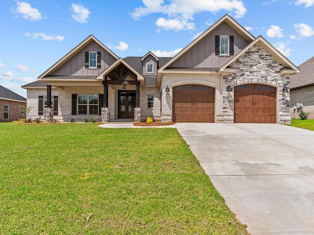 craftsman-style home with board and batten siding, a front yard, concrete driveway, and an attached garage