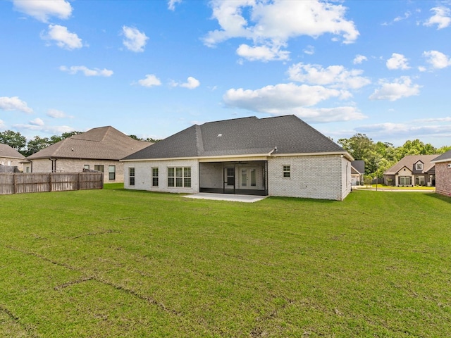 rear view of property featuring a patio area, brick siding, and french doors