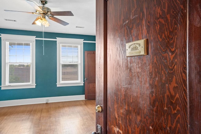307 S Academy St, Geneva, AL 36340 - spare room with baseboards, ceiling fan, and wood finished floors