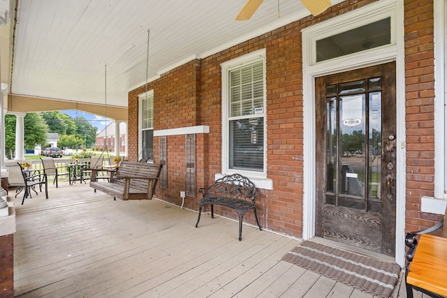 307 S Academy St, Geneva, AL 36340 - wooden porch with a ceiling fan