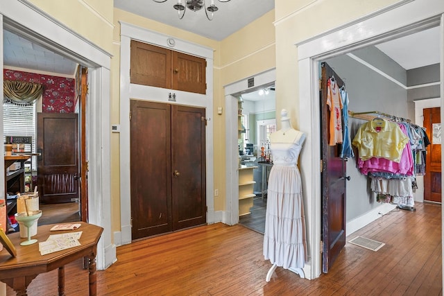 307 S Academy St, Geneva, AL 36340 - entryway featuring hardwood / wood-style floors, a chandelier, and baseboards