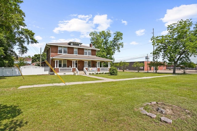 307 S Academy St, Geneva, AL 36340 - view of front of home featuring covered porch, brick siding, and a chimney