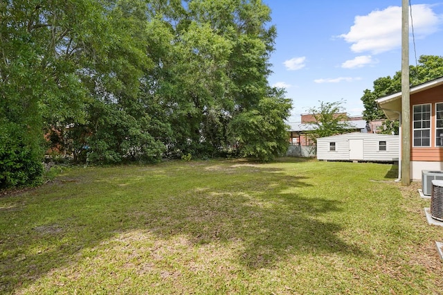 307 S Academy St, Geneva, AL 36340 - view of grassy yard with central air condition unit