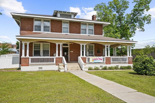 307 S Academy St, Geneva, AL 36340 - american foursquare style home with a porch, brick siding, and a chimney