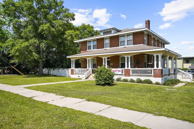 307 S Academy St, Geneva, AL 36340 - view of front of home with brick siding, covered porch, and a chimney