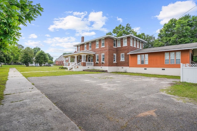 307 S Academy St, Geneva, AL 36340 - view of front of property featuring crawl space, a porch, a chimney, and driveway
