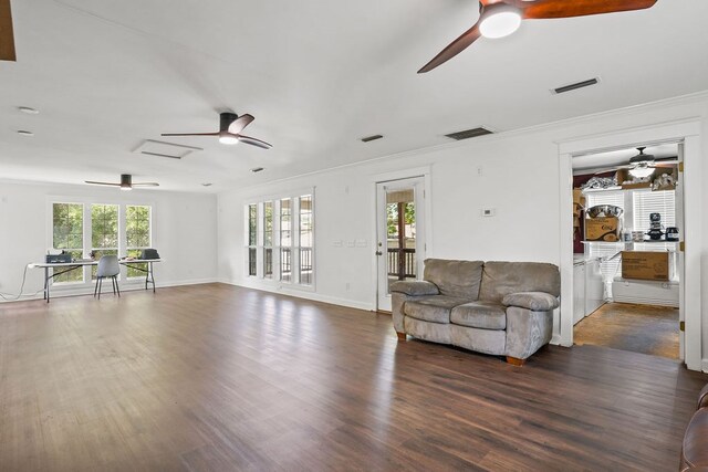 307 S Academy St, Geneva, AL 36340 - living room with ceiling fan, plenty of natural light, dark wood-type flooring, crown molding, and baseboards