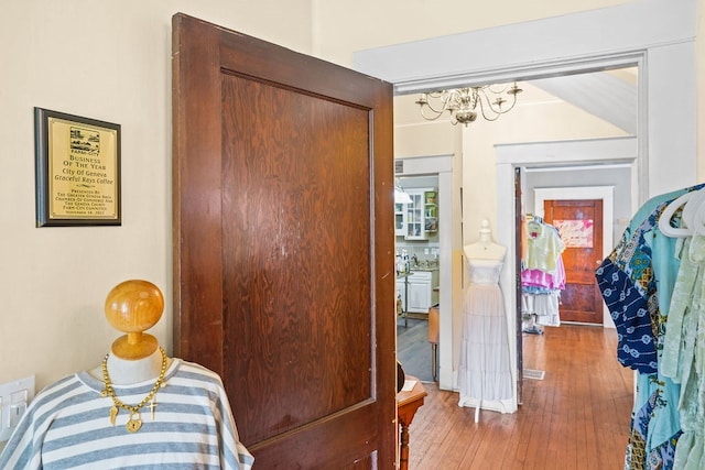 307 S Academy St, Geneva, AL 36340 - bedroom with a chandelier, wood finished floors, and a closet