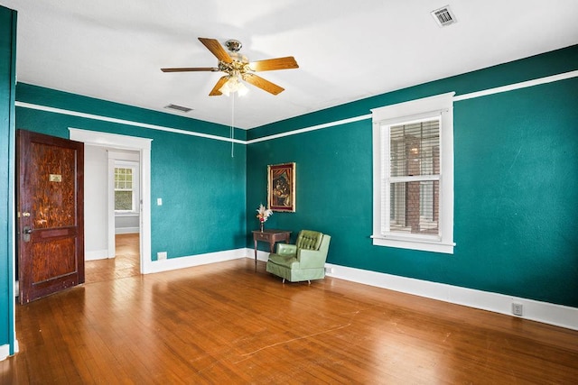 307 S Academy St, Geneva, AL 36340 - sitting room featuring a ceiling fan, wood finished floors, and baseboards