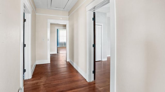 307 S Academy St, Geneva, AL 36340 - hallway featuring attic access, wood finished floors, and baseboards