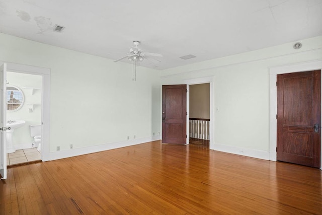 307 S Academy St, Geneva, AL 36340 - unfurnished room with wood finished floors, a ceiling fan, and baseboards