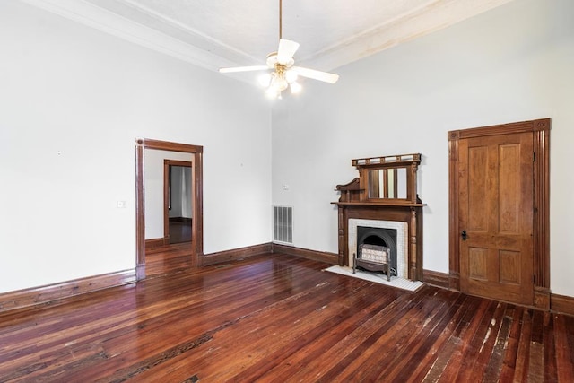 unfurnished living room featuring dark hardwood / wood-style floors and ceiling fan