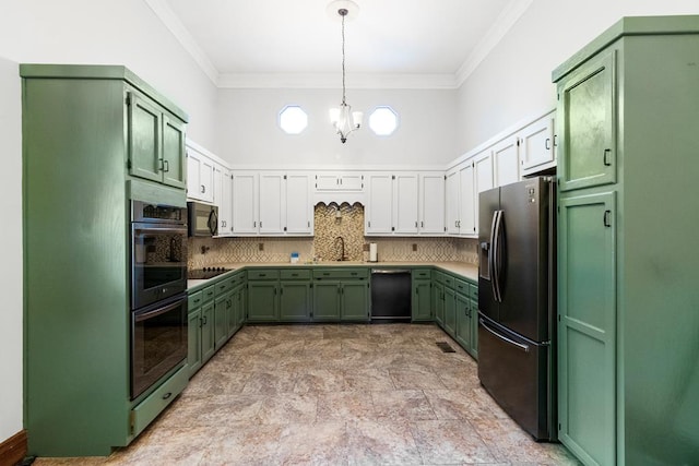 kitchen featuring sink, a notable chandelier, decorative backsplash, black appliances, and green cabinetry