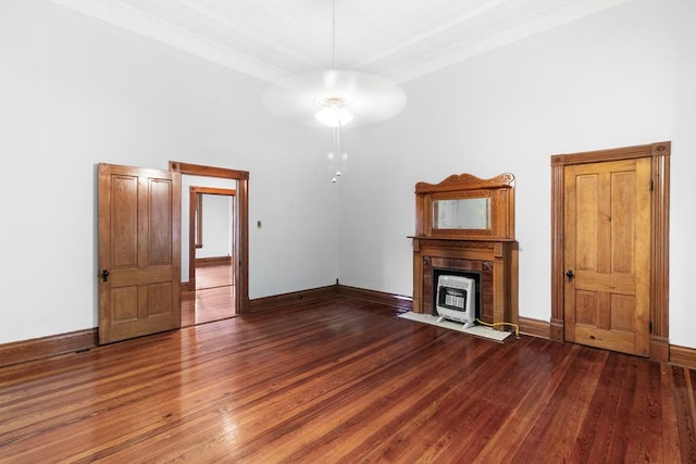 unfurnished living room with dark hardwood / wood-style floors and ceiling fan