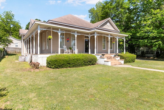 view of front of home with a porch and a front lawn