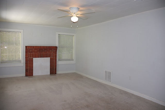 907 E Lee St, Enterprise, AL 36330 - unfurnished living room with crown molding, ceiling fan, carpet floors, baseboards, and plenty of natural light
