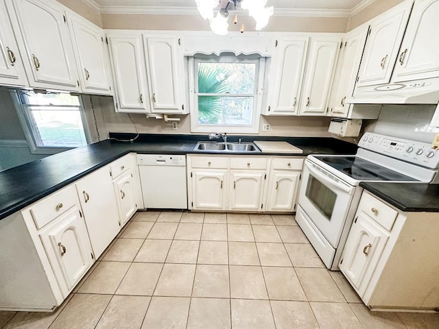 kitchen with white appliances, white cabinetry, a healthy amount of sunlight, and sink